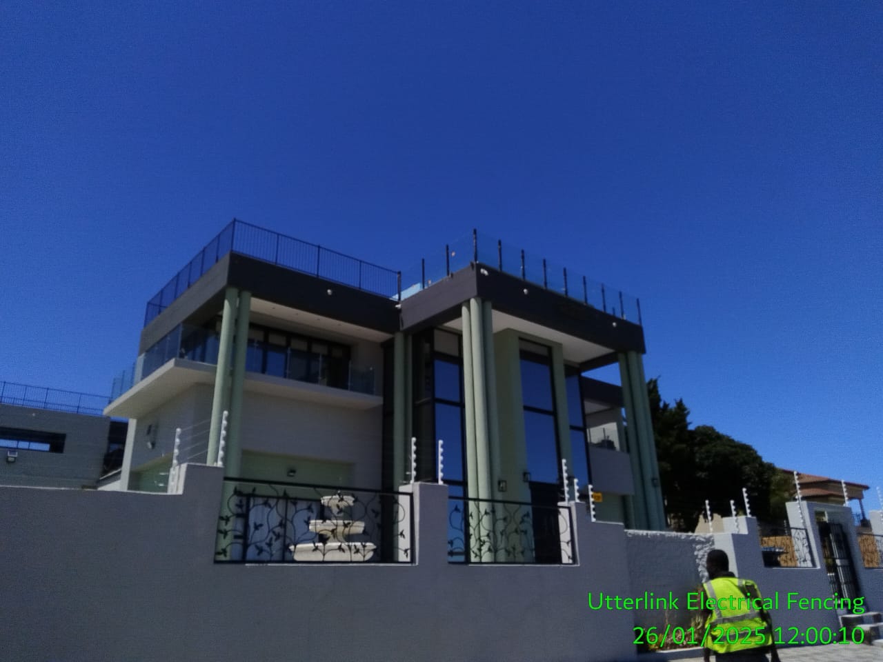 Modern electric fence securing a residential property